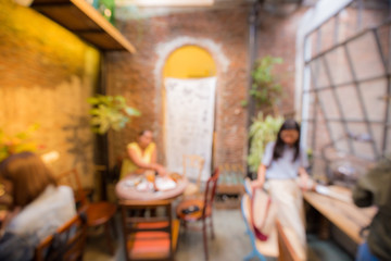 Blurred people in vintage coffee shop indoor urban scene