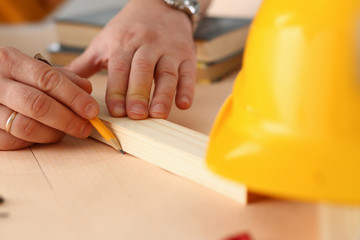 Arms of worker making structure plan on scaled paper closeup. Manual job DIY inspiration improvement job fix shop graphic joinery startup workplace idea designer career industrial education