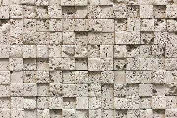 Square beige pebbles for decoration. Stone background