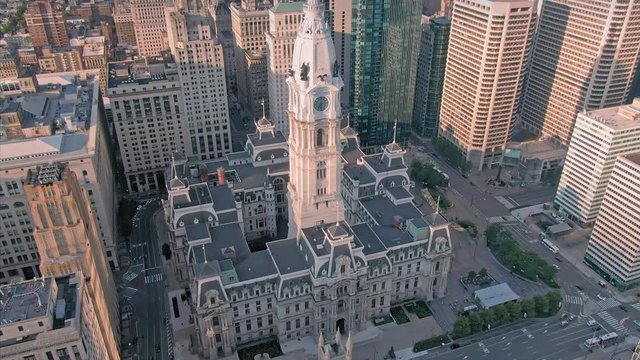 Aerial: Philadelphia City Hall and statue of William Penn over the city skyline. Philadelphia, Pennsylvania, USA. 24 August 2019