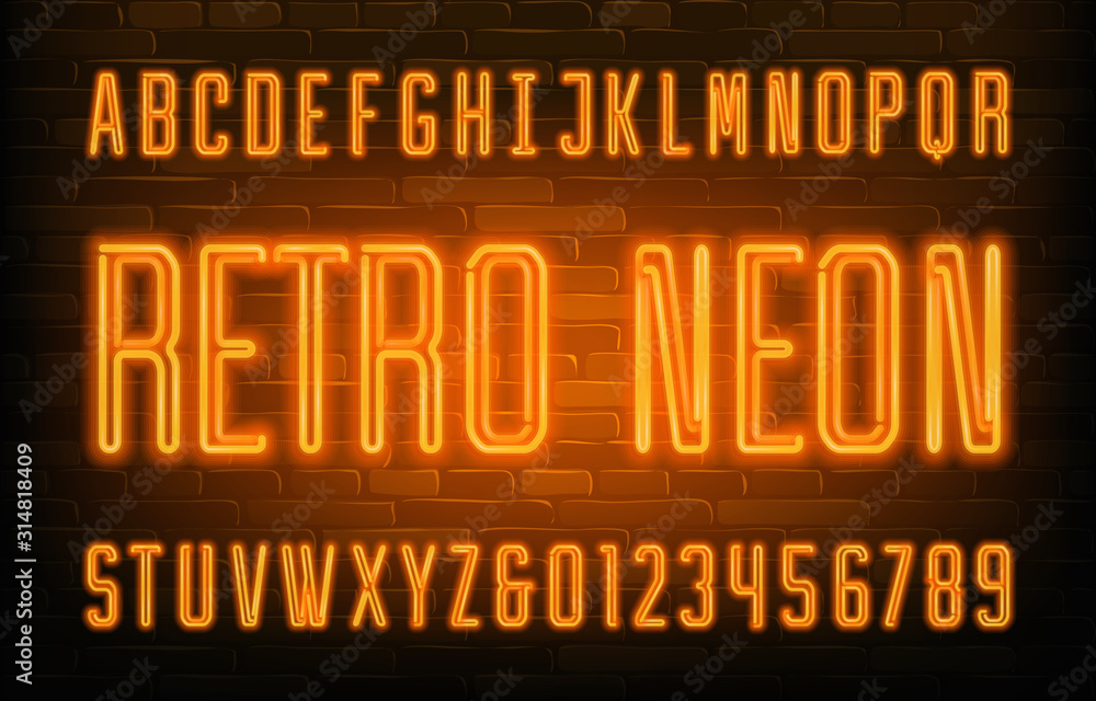 Fototapete retro neon alphabet font. orange neon condensed letters and numbers. brick wall background. stock ve