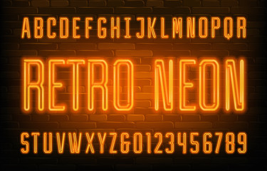 Retro Neon alphabet font. Orange neon condensed letters and numbers. Brick wall background. Stock vector typescript for your typography design.