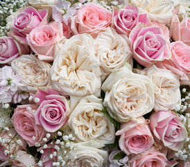 Flower arrangement with pink and white roses. 