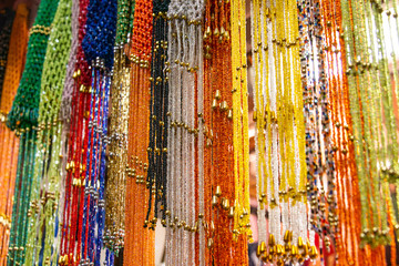EDFU, EGYPT Traditional egyptian colorful pearl chains of jewelery sold at open air market in Edfu Horus Temple