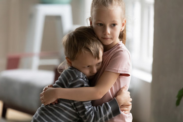 Small children brother and sister hug showing love - obrazy, fototapety, plakaty