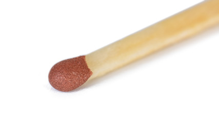 Closeup of red match isolated on white background