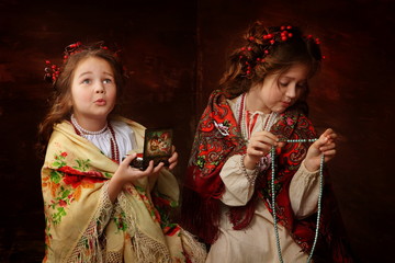 Girls in Russian dresses with beads
