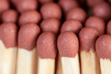 Wooden matches in a box close up. Fire.