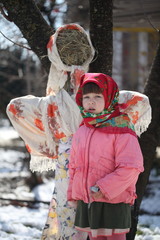Little girl with a doll symbolizing Shrovetide