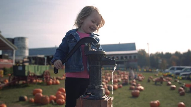 Happy Little Girl Washington Halloween Pumpkin with Water Slow Motion