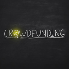 White crowdfunding inscription with light bulb over black background