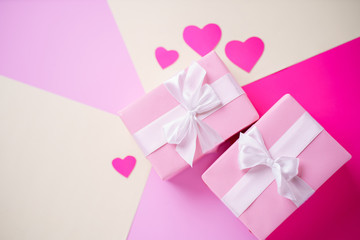 Valentine's, Mother's or Women's Day celebration. creative layout of festive heart shaped decorations and gift boxes, copy space. holidays background concept