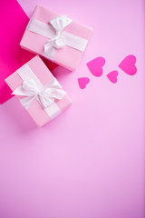 Valentine's, Mother's or Women's Day celebration. creative layout of festive heart shaped decorations and gift boxes, copy space. holidays background concept