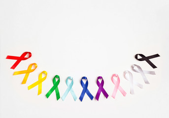 World cancer day concept, February 4. Colorful awareness ribbons on white background. Copy space...