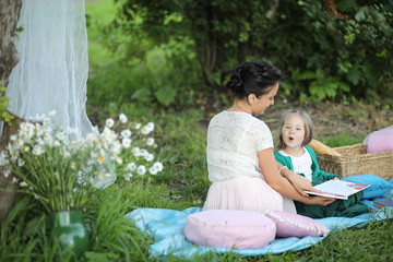 Fototapeta premium mother with daughter at a picnic