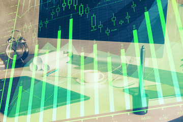 Stock market chart hologram drawn on personal computer background. Multi exposure. Concept of investment.