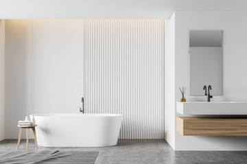 Naklejka na ściany i meble White bathroom interior with tub and sink
