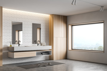White tile and wood bathroom corner with sink