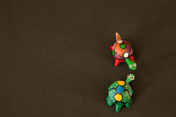 two green and red turtles made of wood, Mexican crafts