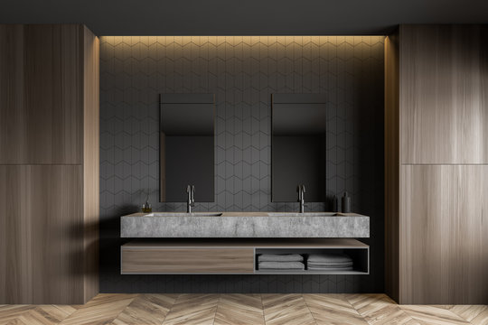 Gray tile and wood bathroom with double sink