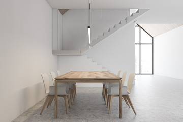 White dining room interior with stairs