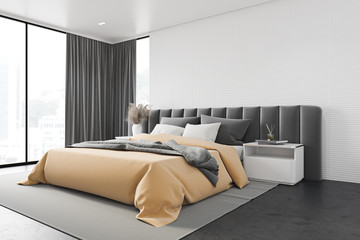 White master bedroom corner with gray bed