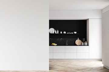 White and black kitchen with mock up wall