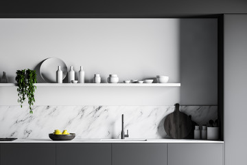 Gray countertops in white kitchen