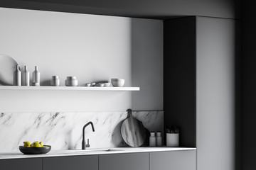 Gray countertops in luxury white marble kitchen