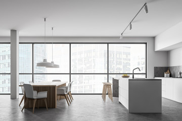 Panoramic white kitchen with bar and table