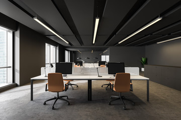 Dark gray open space office with orange chairs