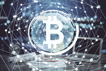 Double exposure of blockchain theme hologram and table with computer background. Concept of bitcoin crypto currency.