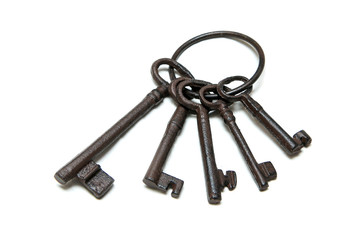 The bunch of old rusty keys in different sizes isolated on a white background.
