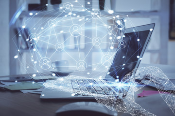 Computer on desktop with social network theme icon. Multi exposure. Concept of international...