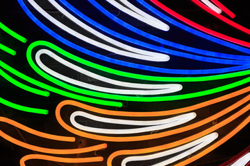 Colorful fluorescent light neon on black background view