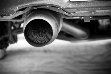 A detail of the end of a rally car´s exhaust. 