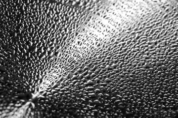 A detail picture of the condensed water on the stainless steel lid. 