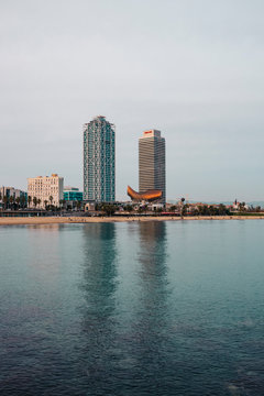 BARCELONA, SPAIN - JANUARY 3, 2020: Twin towers of Torre Mapfre in the afternoon . Mediterranean Coast, Vila Ol&iacute;mpica del Poblenou in Barcelona, Spain.