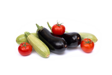 Zucchini and eggplant isolated on white background. Fresh vegetable marrow isolated on white background. Tomatoes , zucchini, eggplant on isolated white background..