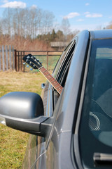 guitar outdoor near car