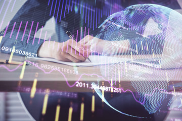 Double exposure hands with stock market chart.