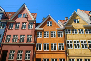 Several old historic houses in Copenhagen in Denmark and their colorful facades.