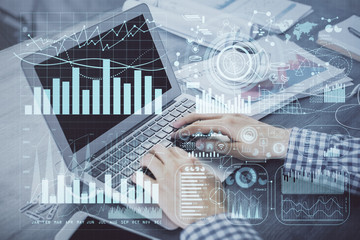 Double exposure of forex graph with man working on computer on background. Concept of market analysis.