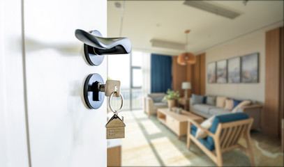 Open door with keys, key in keyhole