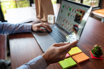 Online shopping credit card data security concept, Hands holding credit card and using smart phone or laptop to shopping or making online payment.