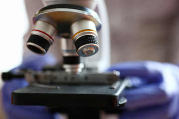 Obraz na płótnie Canvas The head microscope on the background laboratory is a study human biology analyzes for non-compliance with the requirements organization public health at international level