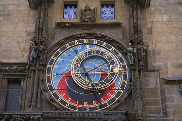 Vintage scene of Prague historical astronomic watch at city central square on Old Town Hall. Photo of colorful European city of Prague in Czech Republic daytime, travel in tourist place.