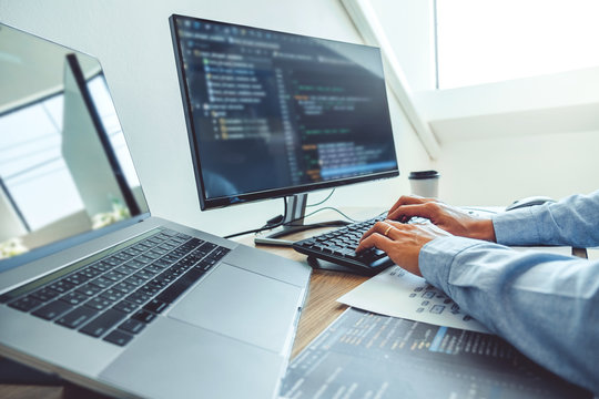 Developing programmer Development Website design and coding technologies working in software company office