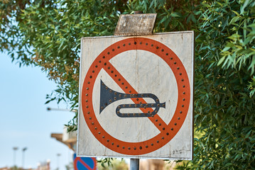 No horn sign in the city street. No honk and no noise for car