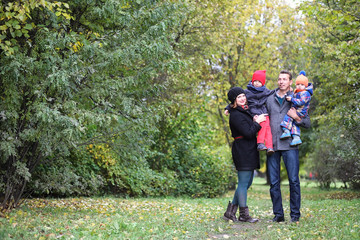 Fototapeta premium Young family with children on a walk